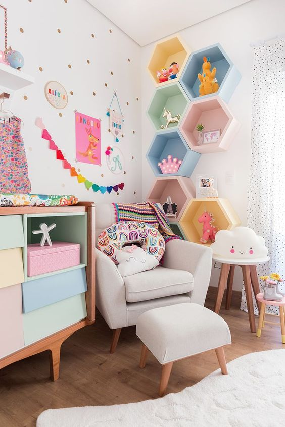Colorful child's room with colorful hexagonal wall cubbies.